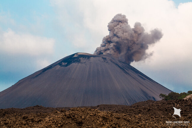 The volcano at Barren island spewing smoke and ash which afforded amazing sunsets