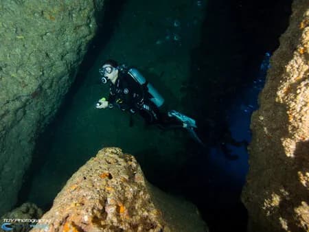 A person enjoys scuba diving in La Paz
