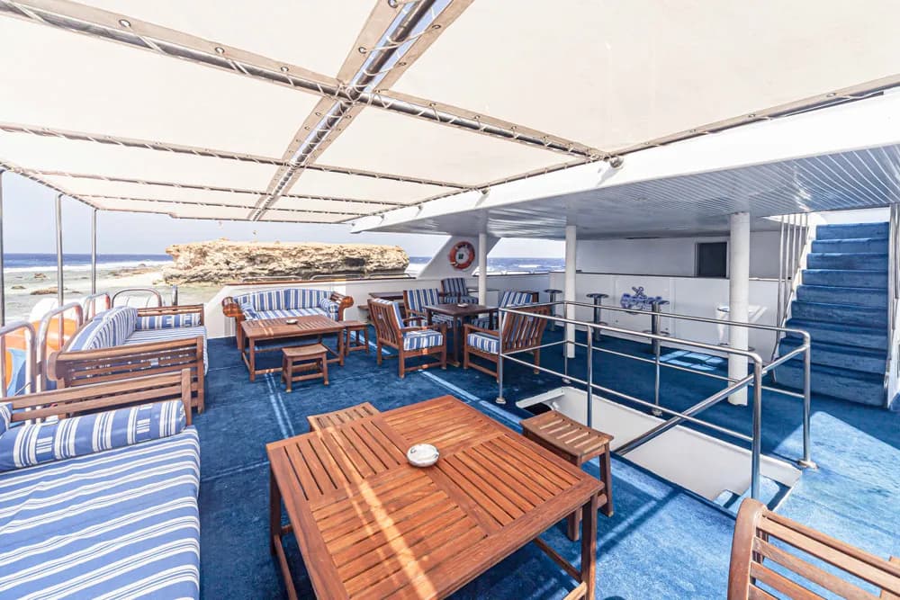An outdoor lounge area on the Royal Evolution liveaboard in the Red Sea.