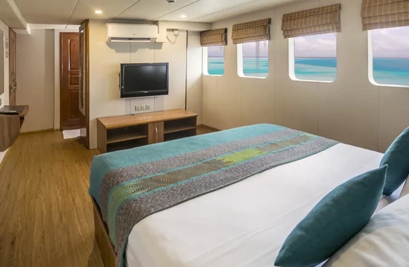 Carpe Diem Maldives suite interior with ocean view.