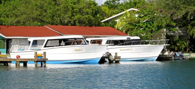 Two dive boats at Fantasy Island Roatan Resort.
