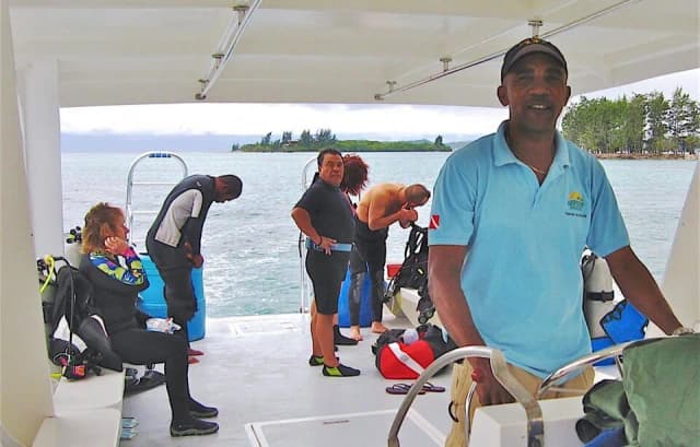 Divers prepare for a scuba dive at Fantasy Island Roatan Resort.