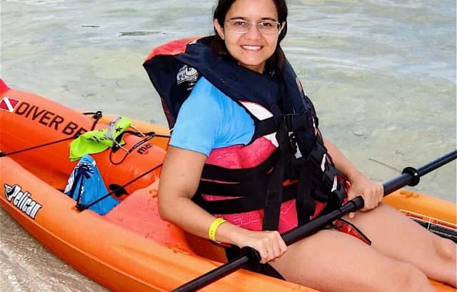 A person in a kayak at Fantasy Island Roatan Resort.
