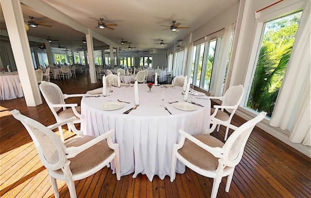 Tables set for dining at Fantasy Island Roatan Resort.