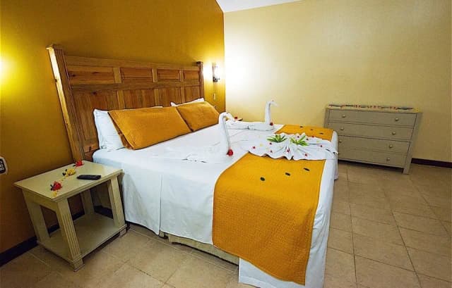 A modern bedroom at Fantasy Island Roatan Resort.