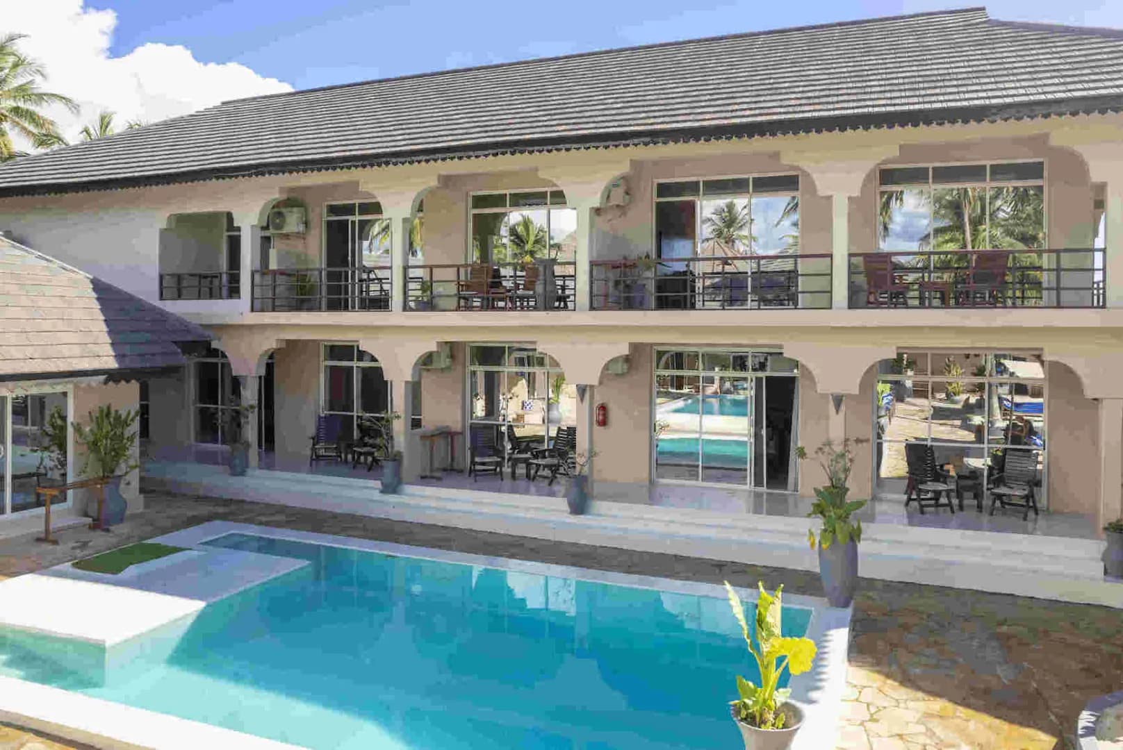 Swimming pool and terrace at Paje Beach Apartments & Hotel Swimming pool and terrace at Paje Beach Apartments & Hotel