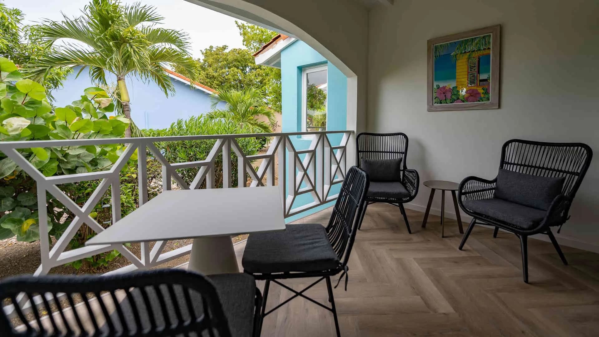 Balcony with chairs and tables Balcony with chairs and tables