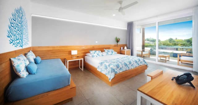 King bed accommodations with balcony and view