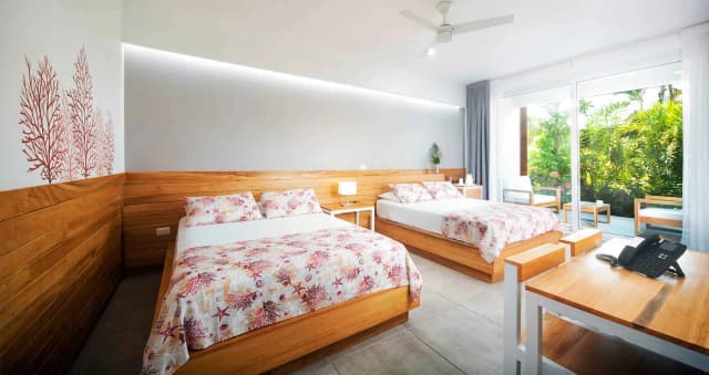 Queen beds overlooking Naboo Resort & Dive Center