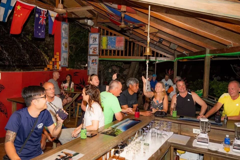 People hang out in a bar at El Galleon