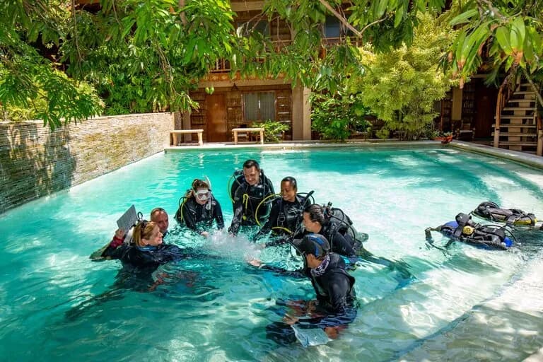 Scuba divers practice in the pool at El Galleon