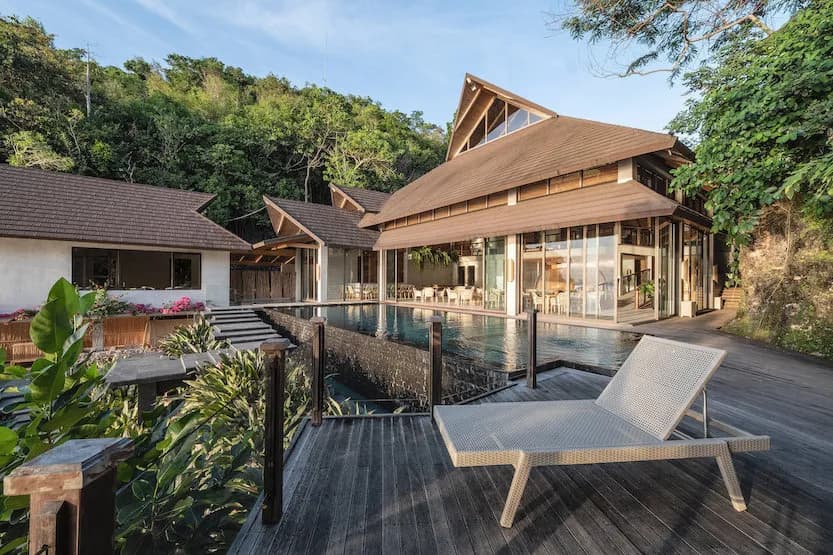 Lounge chair with pool in the background at Manami Resort, Philippines Lounge chair with pool in the background at Manami Resort, Philippines