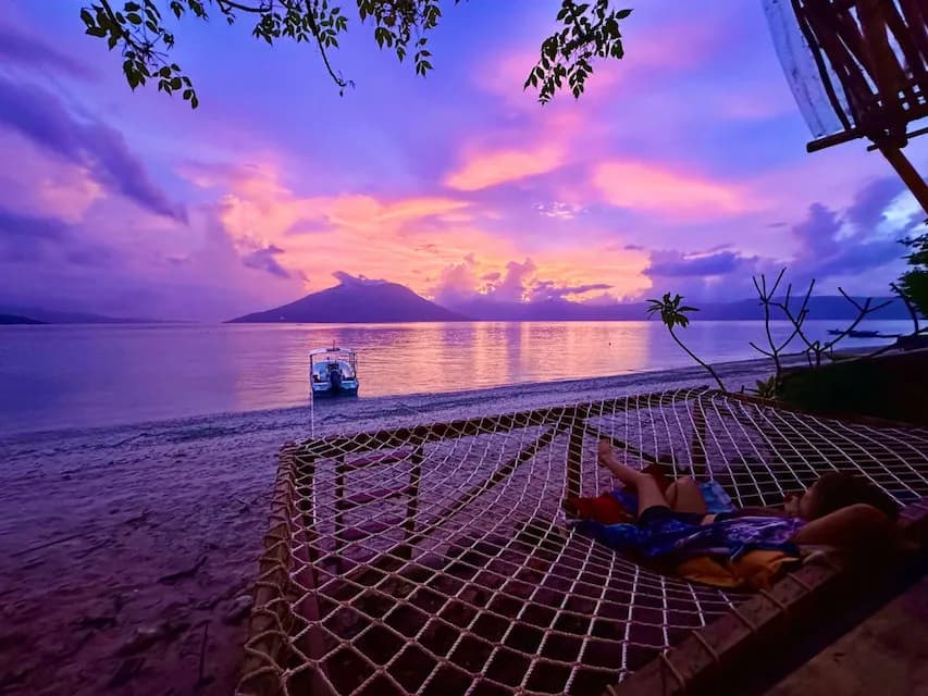 Guests enjoy the post sunset glow from a hammock