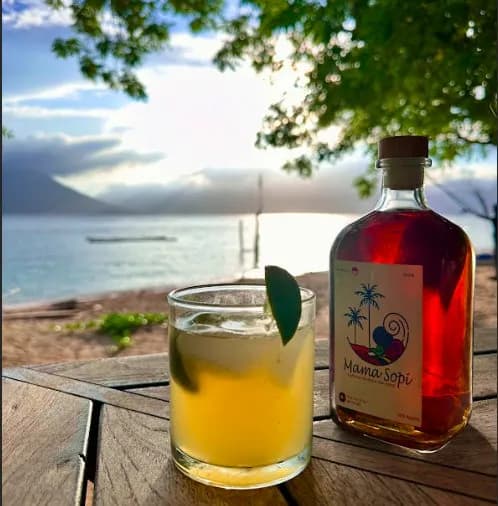 A cool alcoholic beverage set on the deck