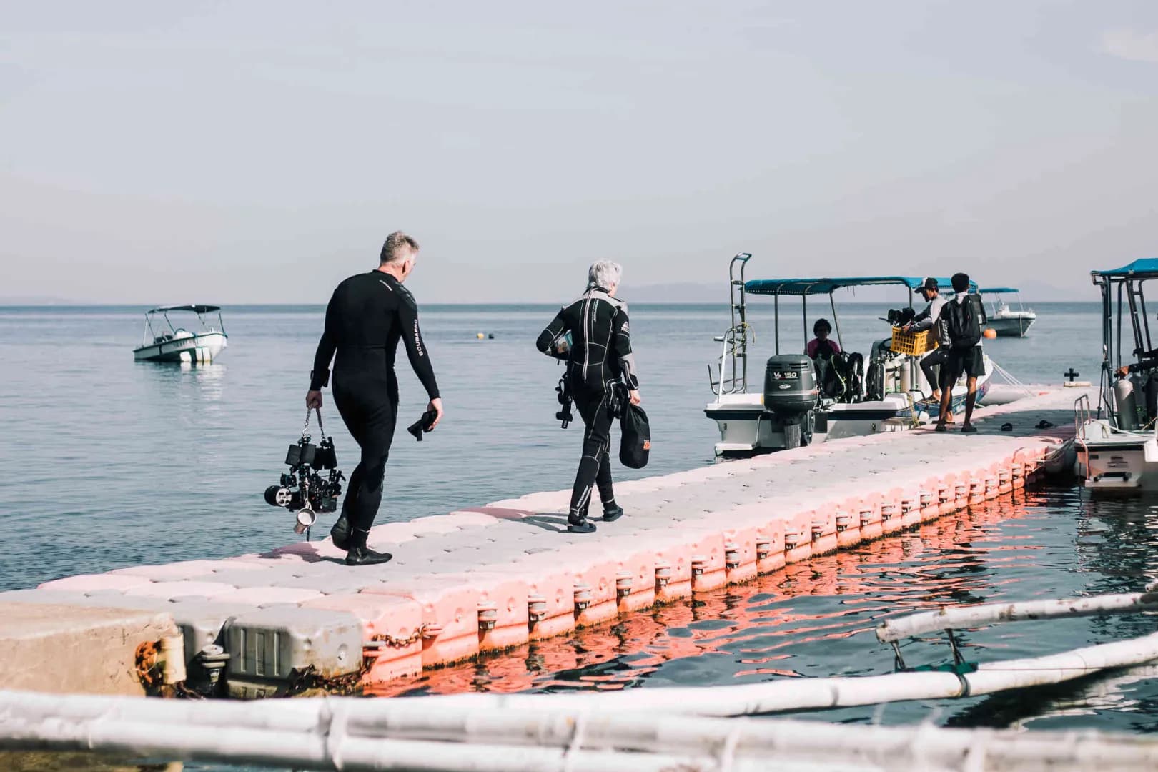Divers crossing the barge