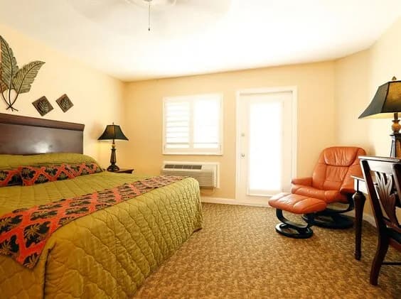 Interior of a room with a king bed at Cayman Brac Beach Resort Interior of a room with a king bed at Cayman Brac Beach Resort