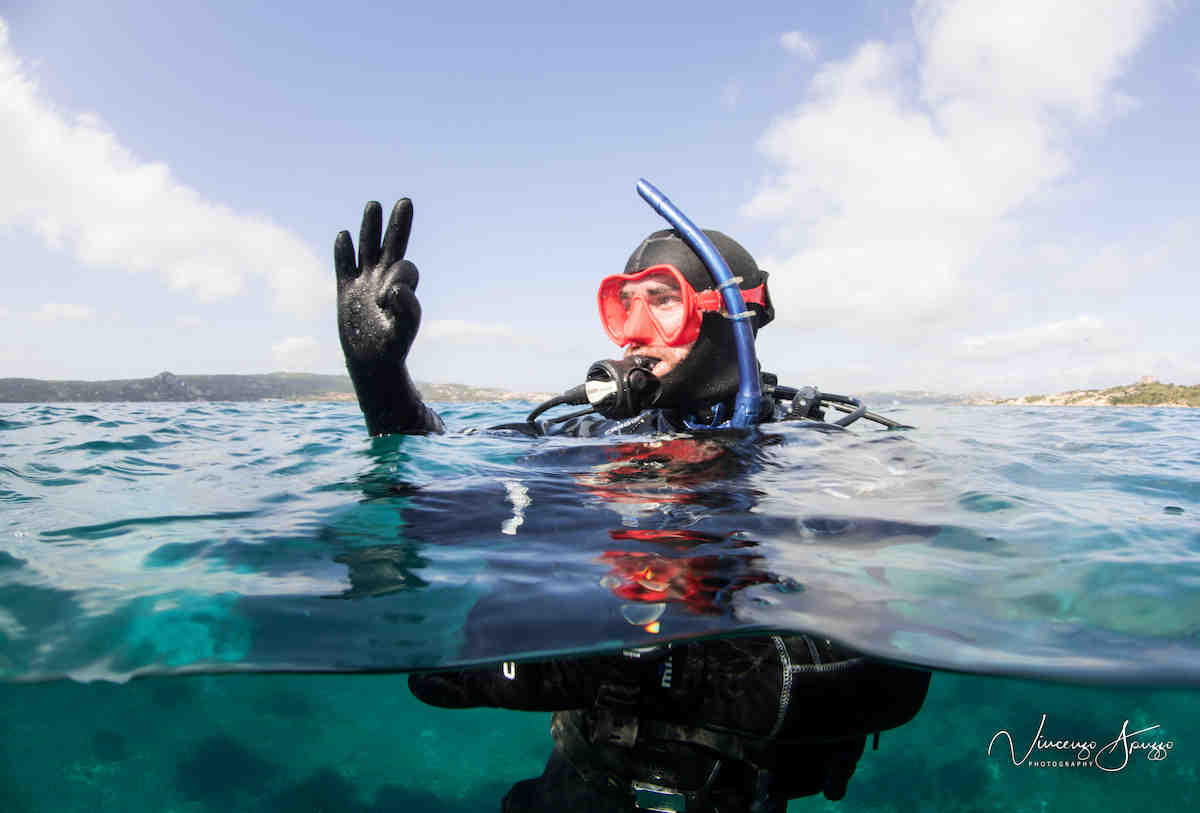 A diver ascends to the surface