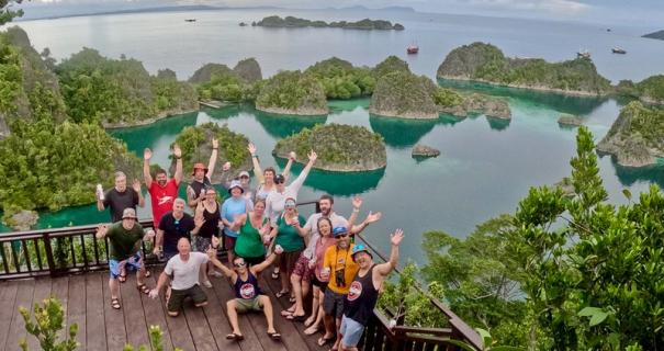 A group of people at Piaynemo viewpoint in Raja Ampat