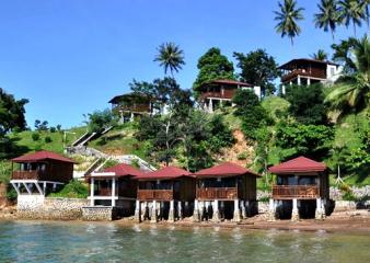 A resort sits next to the ocean in the Lembeh Strait.