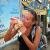 Eating a taco I purchased from the woman making them from scratch under the sign behind me. Utila Town.