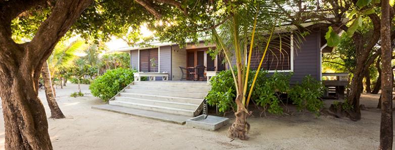 External view of a beachfront villa at Barefoot Caye Roatan