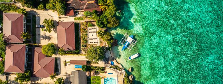 Cebu Seaview Dive Resort ariel view of ocean , pool, and resorts rooms