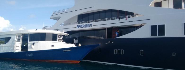 Dive boat alongside the MV Emperor Serenity Liveaboard.