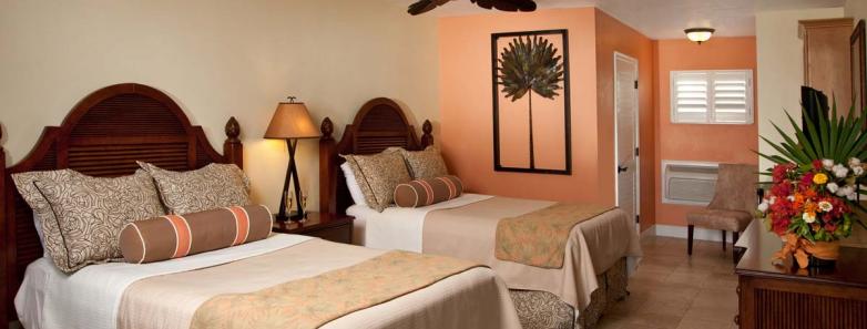 A room with two beds at Little Cayman Beach Resort