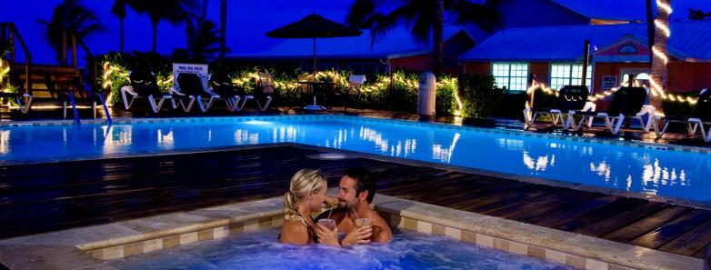A nighttime view of the pool at Little Cayman Beach Resort