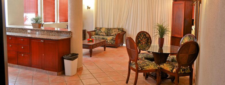 Living area in a master suite at Las Sirenas by Mayan Princess Roatan