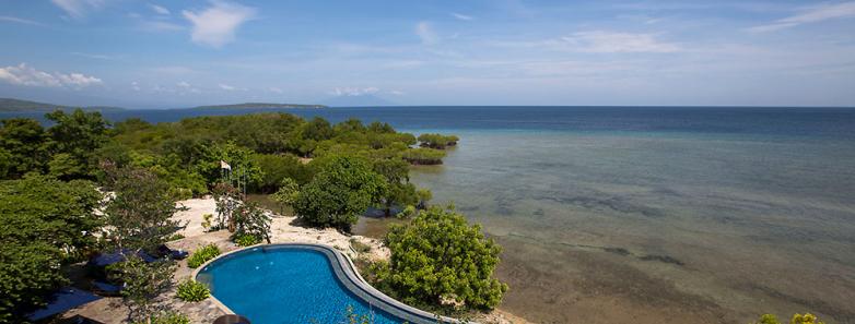 A swimming pool overlooks the sea at Plataran Menjangan Resort & Spa Bali