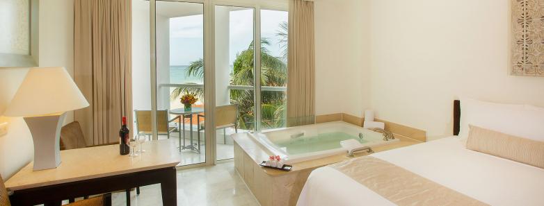 Interior of a superior deluxe partial ocean view room at Playacar Palace.