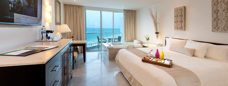 Interior of a superior deluxe ocean view room at Playacar Palace.