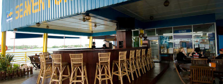 A bar with chairs surrounding it at Seaventures Dive Rig in Malaysia.