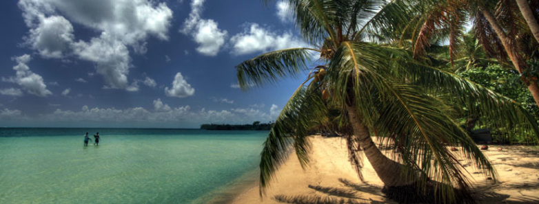 A beach meets the sea at Manta Ray Bay Resort in Yap, Micronesia.