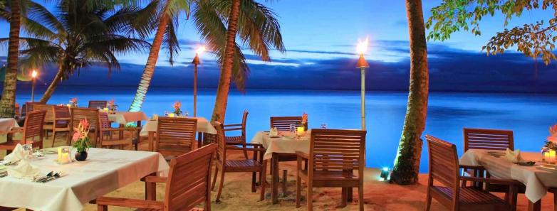Beachside dining tables at Toberua Island Resort Fiji.