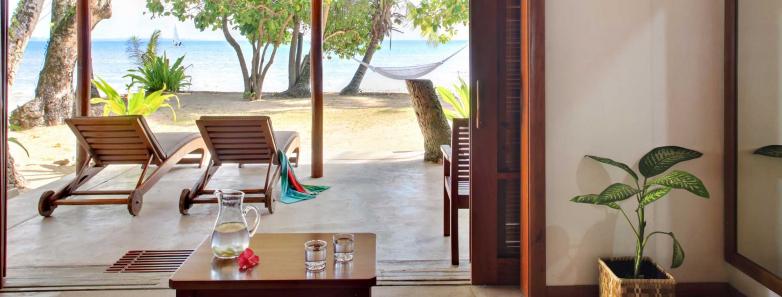 Looking out to the beach from an oceanfront bure at Toberua Island Resort Fiji.