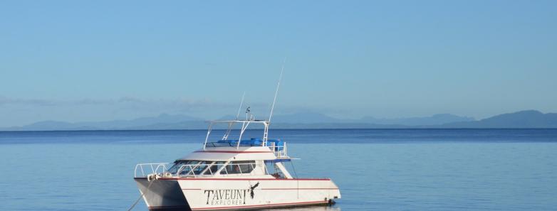 A view of the dive boat from the sea at Paradise Taveuni