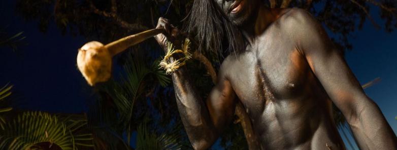 A man in traditional dress represents his culture at Tufi Resort Papua New Guinea