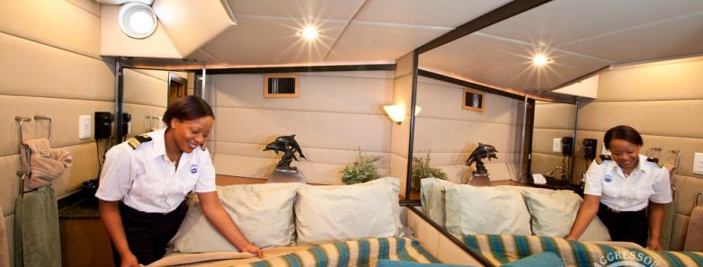 A bed is turned down aboard the Turks & Caicos Aggressor II