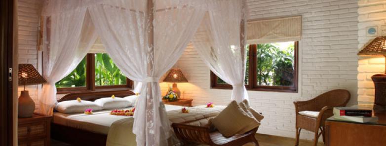 The bedroom of a super deluxe bungalow at Watergarden Resort Bali.