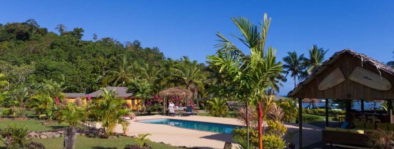 Gardens and pool at Waidroka Bay Resort