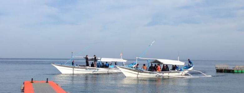 Two dive boats in the water at Aiyanar Beach & Dive Resort
