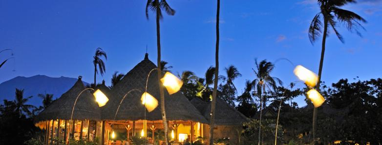 Alam Batu Beach Bungalow Resort Bali lit up at night