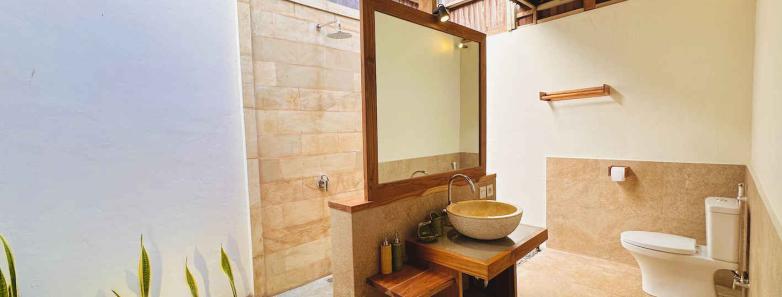 A modern bathroom in a Hillside Bungalow at Alor Tanapi Dive Resort.