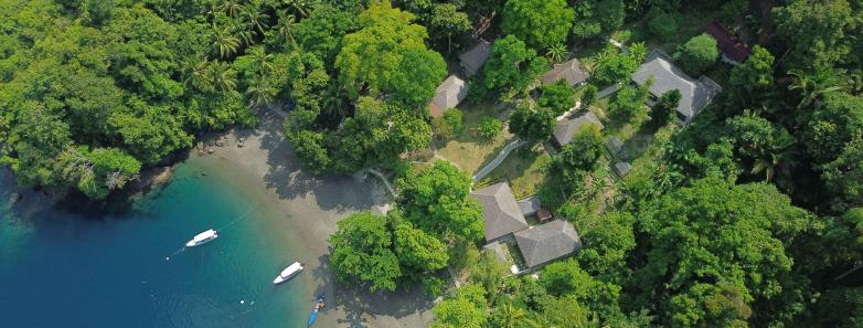 Aerial view of Ambon Dive Resort with their boat