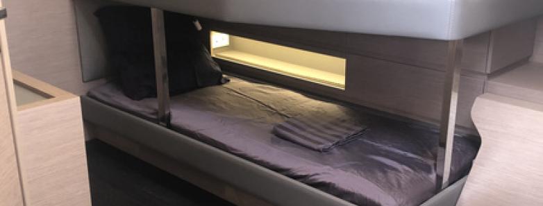 A comfortable bunk cabin aboard the Aqua Tiki III liveaboard.