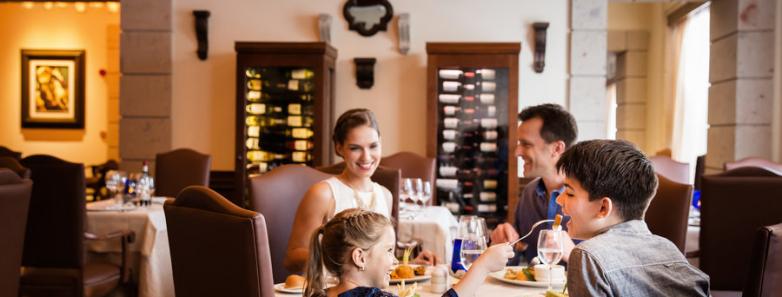A family dines together at Barcelo Maya Grand