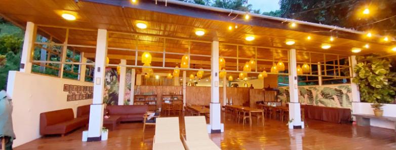 A dining and lounge area at Bastianos Dive Resort Lembeh