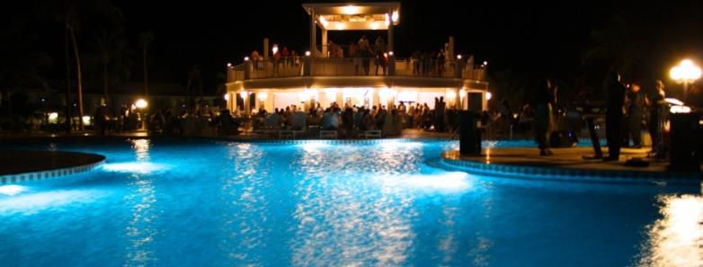 A nighttime view of the pool at Cayman Brac Beach Resort